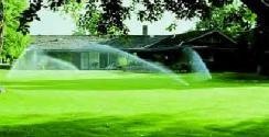 large_yard_and_home_with_sprinklers
